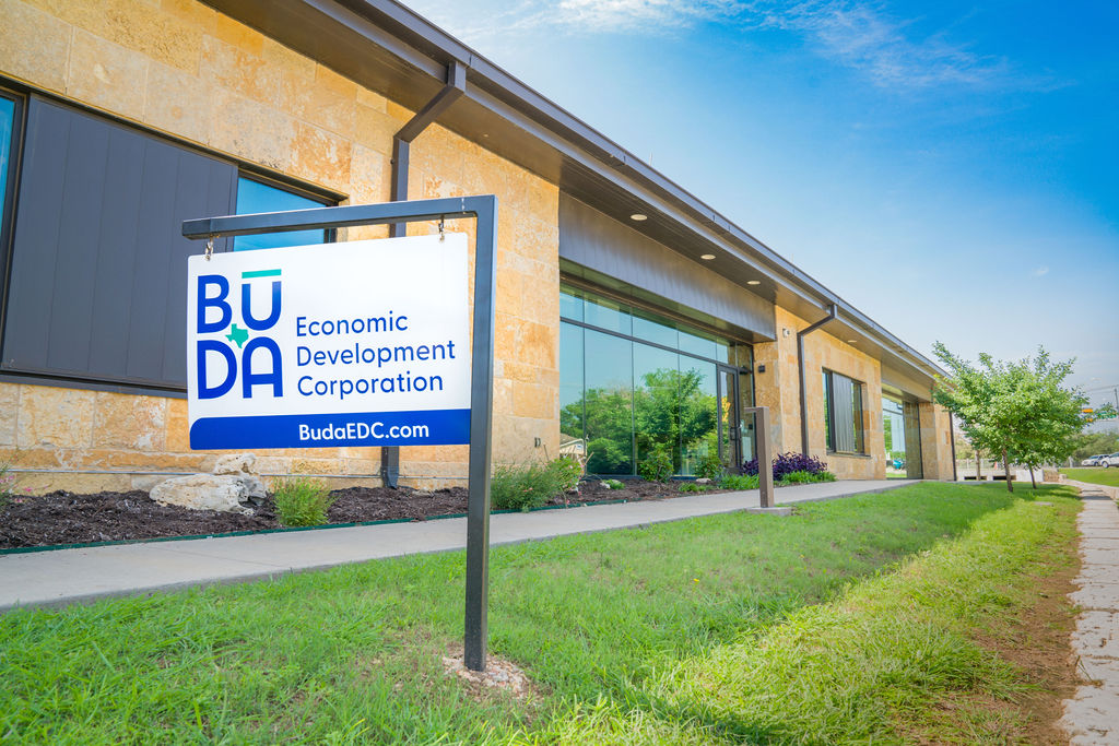 Buda EDC signage in front of building