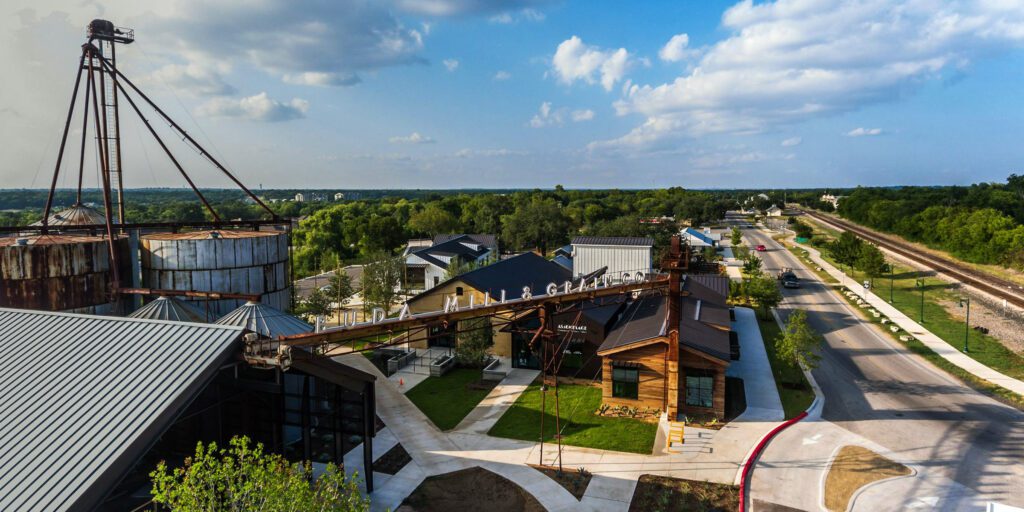 Aerial photo of the Buda Mill & Grain development in downtown buda 