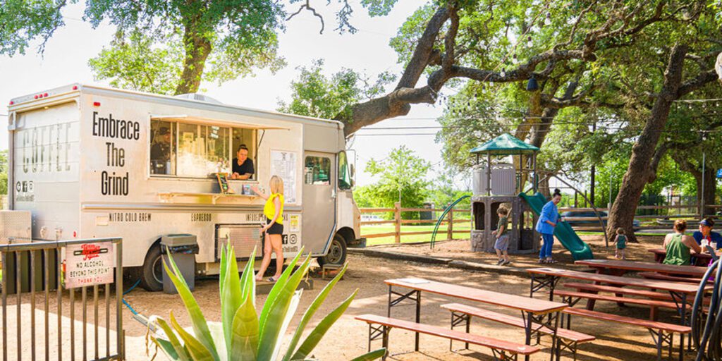 Embrace the Grind Coffee food truck in outdoor eating area