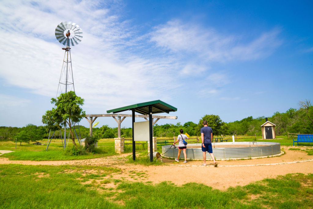 Couple walking near windmill at Stagecoach Park