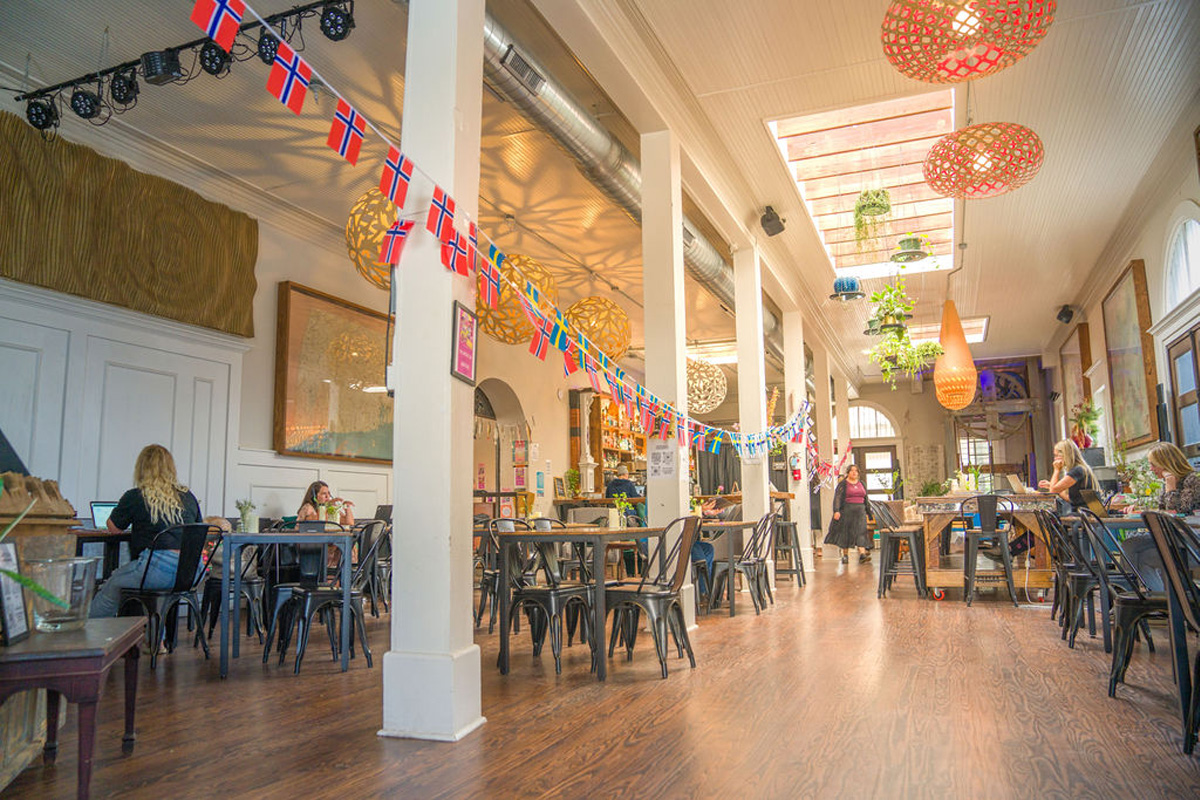 Meridian Coffee And Bakery dining area with chairs and tables and decorative light fixtures