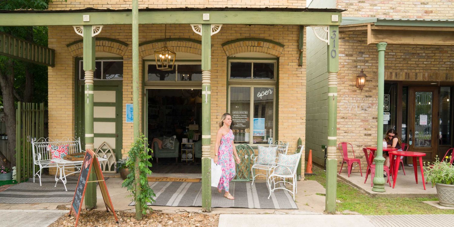 woman walking out of store