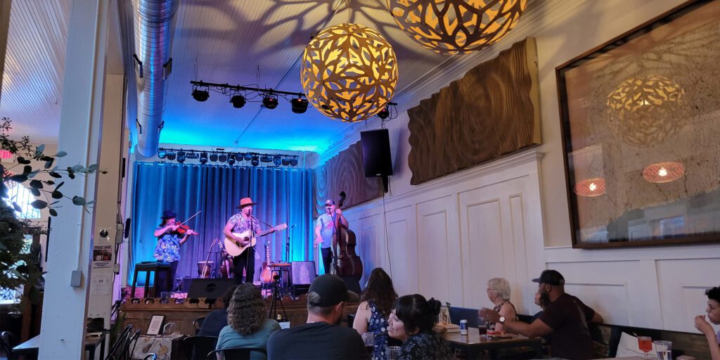 band playing on stage in bar