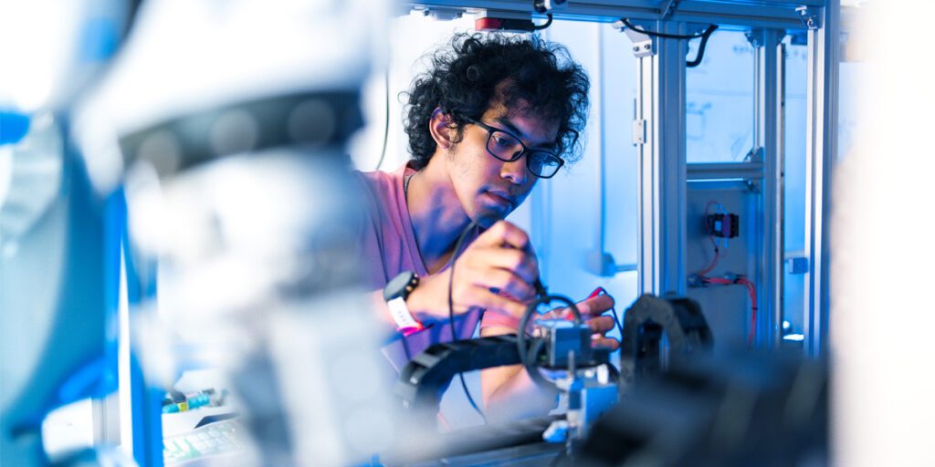 Man working on Chip manufacturing equipment